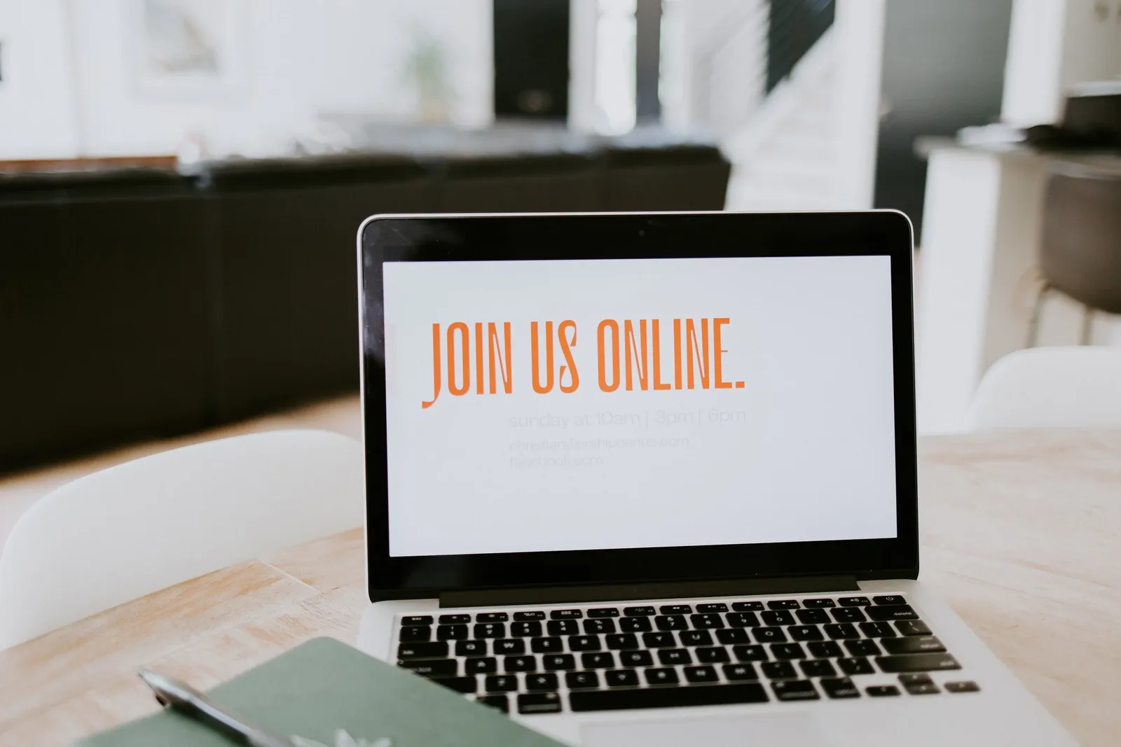 Laptop on a desk with a screen reading Join Us Online
