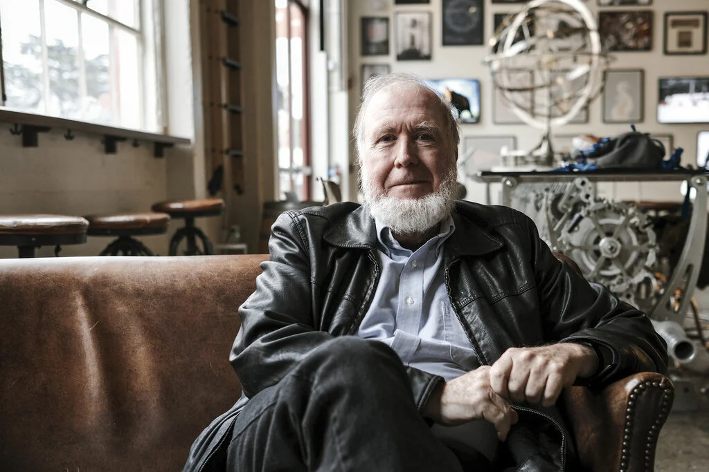 Kevin Kelly, author of 1,000 True Fans, seated in a leather chair